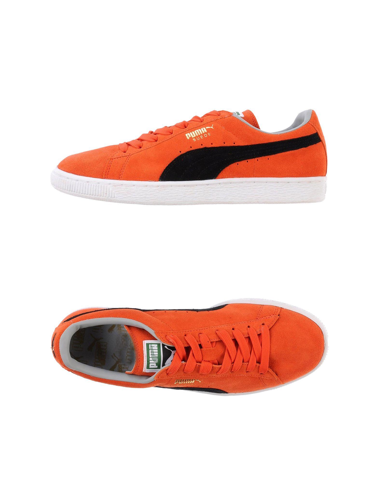 Sneakers arancione bassa in pelle suede con punta tonda e striscia nera puma