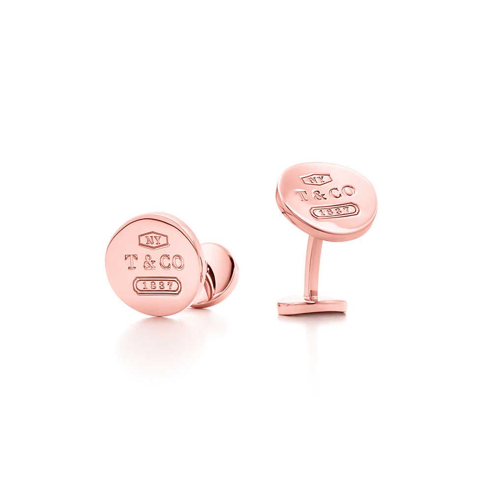 Gemelli tondi in metallo rubedo di colorazione rosa con marchio T& Co 1837